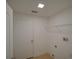 A clean laundry room featuring tile floors, white walls and a laundry hookups at 879 Nonastone Run, Casselberry, FL 32707