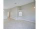 Bright, neutral living room featuring tile floors, recessed lighting and modern fixtures at 879 Nonastone Run, Casselberry, FL 32707