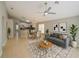 Staged living space connecting the kitchen with furniture and decor at 879 Nonastone Run, Casselberry, FL 32707