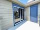 Private balcony with sliding glass doors and a blue storage closet at 936 Birmingham Ct # 200, Lake Mary, FL 32746