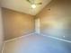 Bedroom featuring vaulted ceilings, neutral carpet and paint, and a door to the hallway at 936 Birmingham Ct # 200, Lake Mary, FL 32746