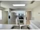 Bright kitchen featuring stainless steel appliances, white cabinets, and a double basin sink at 936 Birmingham Ct # 200, Lake Mary, FL 32746