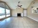 Light living room with tile flooring, a brick fireplace, vaulted ceiling, and recessed lights at 936 Birmingham Ct # 200, Lake Mary, FL 32746