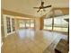 Open-concept living room features tile flooring, fireplace, and lots of natural light at 936 Birmingham Ct # 200, Lake Mary, FL 32746