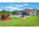 Lush backyard with pool and covered patio area perfect for outdoor entertaining at 9780 Cypress Pine St, Orlando, FL 32827