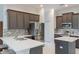Well-appointed kitchen with stainless steel appliances, mosaic backsplash, and abundant counter space at 9780 Cypress Pine St, Orlando, FL 32827