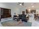 Comfortable living room with stylish decor, open to the kitchen and dining area, ideal for Gathering gatherings at 9780 Cypress Pine St, Orlando, FL 32827