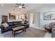 Inviting living room with an open floor plan connecting to the kitchen and dining areas at 9780 Cypress Pine St, Orlando, FL 32827