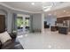 Spacious living room featuring modern lighting and an open floor plan, great for entertaining at 9780 Cypress Pine St, Orlando, FL 32827