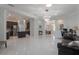 Expansive living area with open layout, flowing into the kitchen and dining areas, with abundant natural light at 9780 Cypress Pine St, Orlando, FL 32827