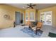 Covered patio area with outdoor seating and ceiling fan, perfect for entertaining at 9780 Cypress Pine St, Orlando, FL 32827