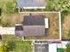 Aerial view of home with neutral roof, fenced yard, and a driveway on the left side at 9821 8Th Ave, Orlando, FL 32824