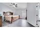 Bedroom with a queen-sized bed, ceiling fan, and a large window that let's in natural light at 9821 8Th Ave, Orlando, FL 32824