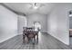 Dining room with gray walls, chair railing, and a sliding glass door leading to the backyard at 9821 8Th Ave, Orlando, FL 32824