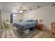 Comfortable bedroom featuring neutral walls, wood-look floors, and lots of natural light for relaxation and rest at 985 N Village Dr, Deltona, FL 32725