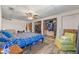 View of the bedroom with an open closet, ceiling fan, and an accent chair at 985 N Village Dr, Deltona, FL 32725