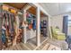 Walk-in closet is spacious, featuring ample storage and shelving for clothes and accessories in the main bedroom at 985 N Village Dr, Deltona, FL 32725