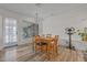 Bright dining room featuring laminate floors and ample natural light at 985 N Village Dr, Deltona, FL 32725