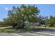 Well-kept single-story home with mature trees, set on a corner lot at 985 N Village Dr, Deltona, FL 32725