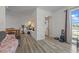 Inviting open-concept space with new flooring, connecting the living room and dining area at 985 N Village Dr, Deltona, FL 32725