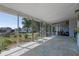 Spacious screened-in patio offers a comfortable outdoor space for relaxation and entertainment at 985 N Village Dr, Deltona, FL 32725