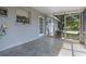 Enclosed patio with painted walls, window, and door, offering a versatile outdoor living space at 985 N Village Dr, Deltona, FL 32725