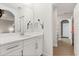 Bathroom featuring a modern sink and finishes with an open view of hallway at 9873 Lost Creek Dr, Winter Garden, FL 34787