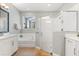 Bright bathroom with glass shower, bathtub, and white vanity at 9873 Lost Creek Dr, Winter Garden, FL 34787