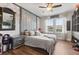 Bedroom featuring a ceiling fan, wooden floors, and unique decor at 9873 Lost Creek Dr, Winter Garden, FL 34787