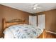 Bedroom featuring wood floors and a blue and white bedspread at 1003 S Center St, Eustis, FL 32726