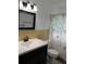 Bathroom showcasing stylish vanity, decorative shower curtain, and functional layout at 10208 Brownwood Ave, Orlando, FL 32825