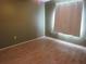 Bedroom with neutral walls and tile flooring, and window with curtain at 10208 Brownwood Ave, Orlando, FL 32825