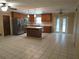 Open kitchen features stainless steel appliances, breakfast bar and ample cabinet storage space at 10208 Brownwood Ave, Orlando, FL 32825