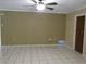 Bright, open living room features tile flooring and neutral paint at 10208 Brownwood Ave, Orlando, FL 32825