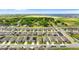 Aerial view of a residential neighborhood highlighting a planned community with green spaces and a nearby lake at 1120 Mattie Pointe Blvd, Auburndale, FL 33823