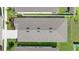 Overhead view of the home's roof, lawn and landscaping in a well-maintained residential community at 1120 Mattie Pointe Blvd, Auburndale, FL 33823