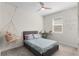 Charming bedroom with light walls, ceiling fan, and hanging chair, offering a relaxing space at 1120 Mattie Pointe Blvd, Auburndale, FL 33823