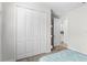Bedroom with large closet and doorway to another room, providing ample storage and access at 1120 Mattie Pointe Blvd, Auburndale, FL 33823