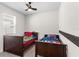 Cozy bedroom with two twin beds, ceiling fan, and ample natural light creating a comfortable space at 1120 Mattie Pointe Blvd, Auburndale, FL 33823