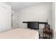 Cozy bedroom with a flat screen tv and bedside table, creating a relaxing space for rest and entertainment at 1120 Mattie Pointe Blvd, Auburndale, FL 33823