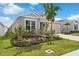 Landscaped front yard with vibrant plantings accentuates this lovely single-Gathering home at 1120 Mattie Pointe Blvd, Auburndale, FL 33823