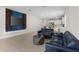 Spacious living room with tile floors seamlessly connecting to an open-concept kitchen at 1120 Mattie Pointe Blvd, Auburndale, FL 33823
