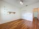 Bedroom features hardwood floors, ceiling fan, double closet and bright window at 1131 Turtle Lake Ct, Ocoee, FL 34761