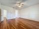 Spacious bedroom featuring hardwood floors and two closets for ample storage at 1131 Turtle Lake Ct, Ocoee, FL 34761