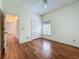 Bedroom with hardwood floors, a double closet, and a bright window at 1131 Turtle Lake Ct, Ocoee, FL 34761