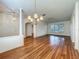 Spacious living room with hardwood floors, natural light, and elegant chandelier at 1131 Turtle Lake Ct, Ocoee, FL 34761