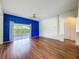 Open living room featuring a sliding glass door and adjacent closet space at 1131 Turtle Lake Ct, Ocoee, FL 34761