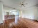 Open living area featuring hardwood floors and breakfast bar area at 1131 Turtle Lake Ct, Ocoee, FL 34761
