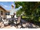Secluded backyard with a patio dining set under the shade of lush trees, perfect for relaxation at 1135 Plato Ave, Orlando, FL 32809