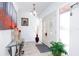 Bright foyer with double doors, tiled floors, and elegant décor, creating a welcoming entrance at 1135 Plato Ave, Orlando, FL 32809